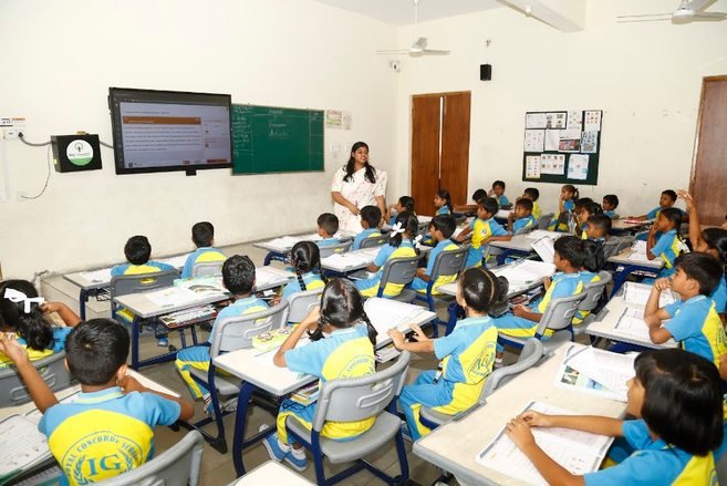 A teacher using the smart classroom display during a lesson