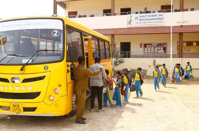 The Royal Concorde School building on Chandrabanda Road, Raichur, as students arrive